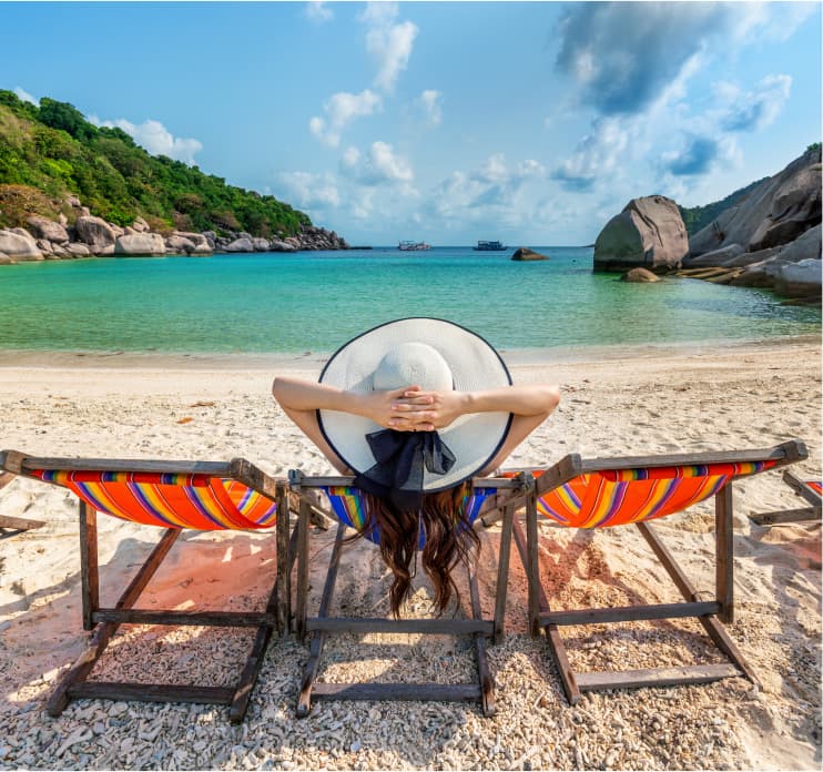 Traveller relaxing on a pristine tropical beach